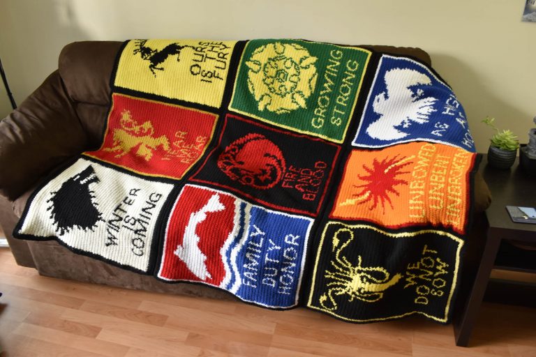 crochet game of thrones sigil blanket displayed on a couch