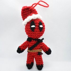 crochet ornament of deadpool wearing a santa hat
