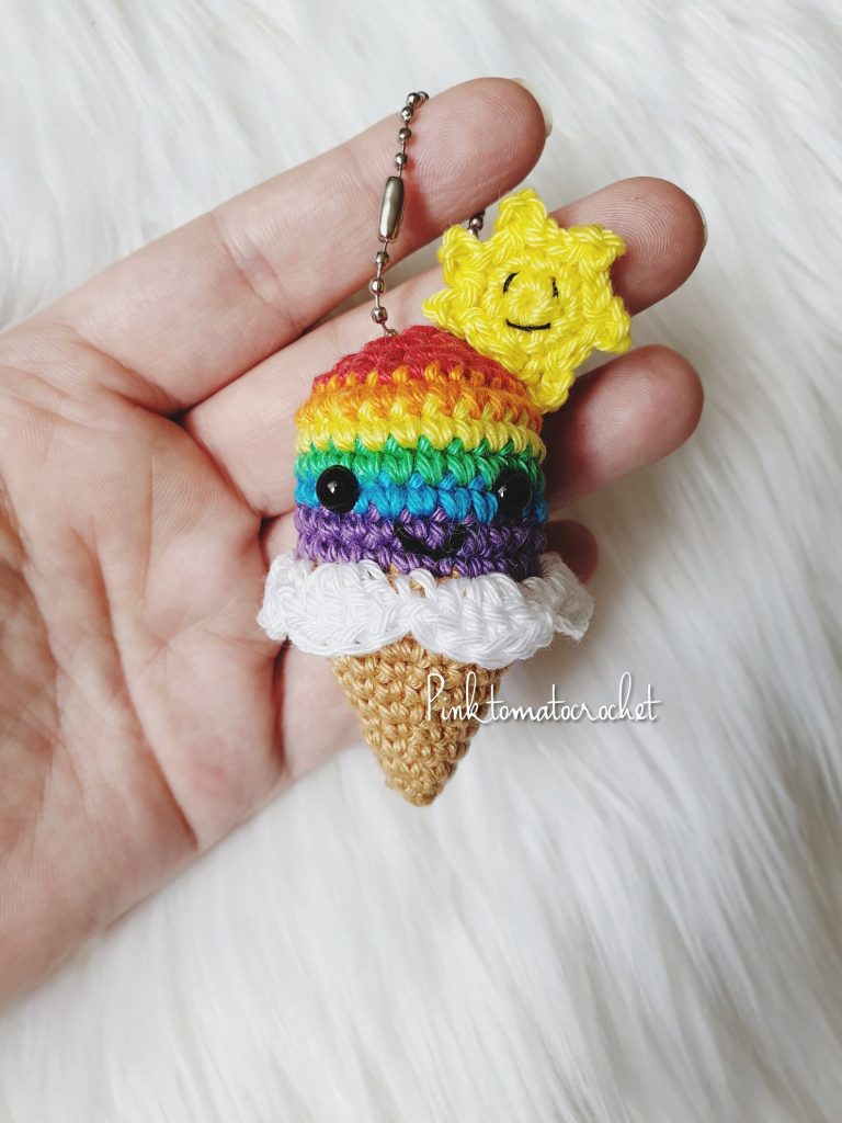 a small crochet rainbow ice cream cone