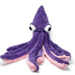 a large crochet kraken made out of chunky yarn. The body is purple and the underside of the tentacles are light pink.